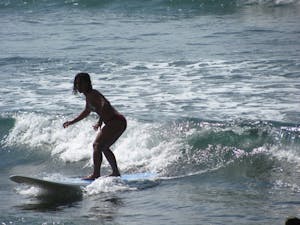 Woman surfing in Oahu