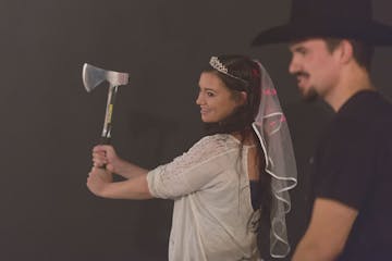 Bride axe throwing at her bachelorette
