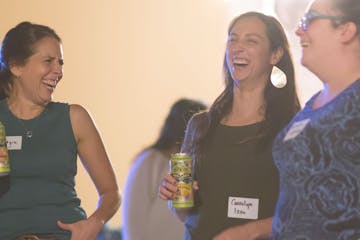 Women laughing with drinks