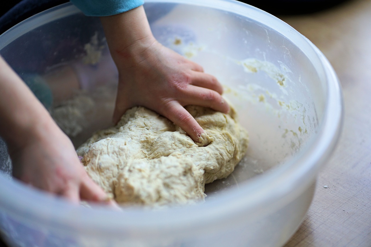 Kid working with dough