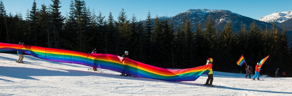 a colorful pride flag going down Whistler mountain
