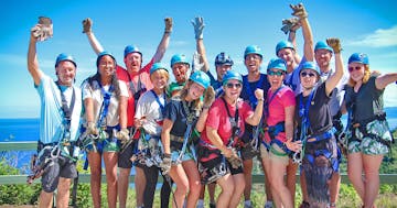 A group of zipliners posing for a picture