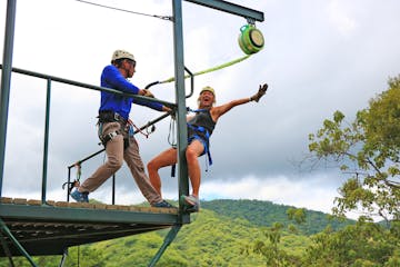 A woman getting ready to jump into her zipline adventure