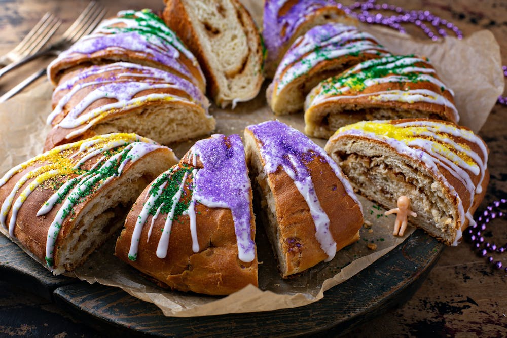 King cake for Mardi Gras, New Orlean traditional pastry with a plastic baby