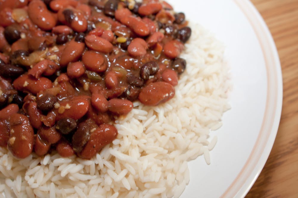 Black beans and kidney beans on top of rice on a plate