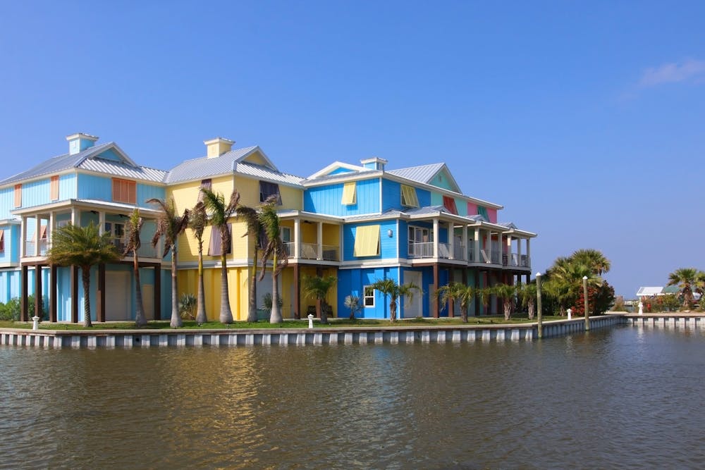 The neighborhood, rebuilt after a hurricane, with brightly colored houses for vacation rentals near Grand Isle State Park, Louisiana, USA.