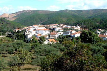 A view of a large mountain in the background in the Shale Villages in Portugal