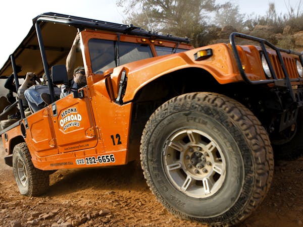 close up of orange hummer on a trail