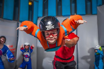 A child poses for a photo while participating in indoor skydiving in Las Vegas