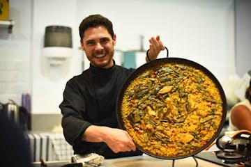 Expect to eat a tasty paella like this one in our Seville Cooking Class!