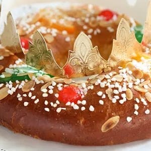 a close up of a piece of spanish roscon de reyes cake on a plate
