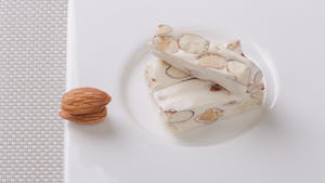 a piece of turron spanish nougat on a plate