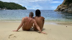 a couple enjoy the nude beach