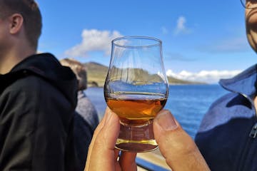 Man holding a whisky glass on our four day islay whisky tour!