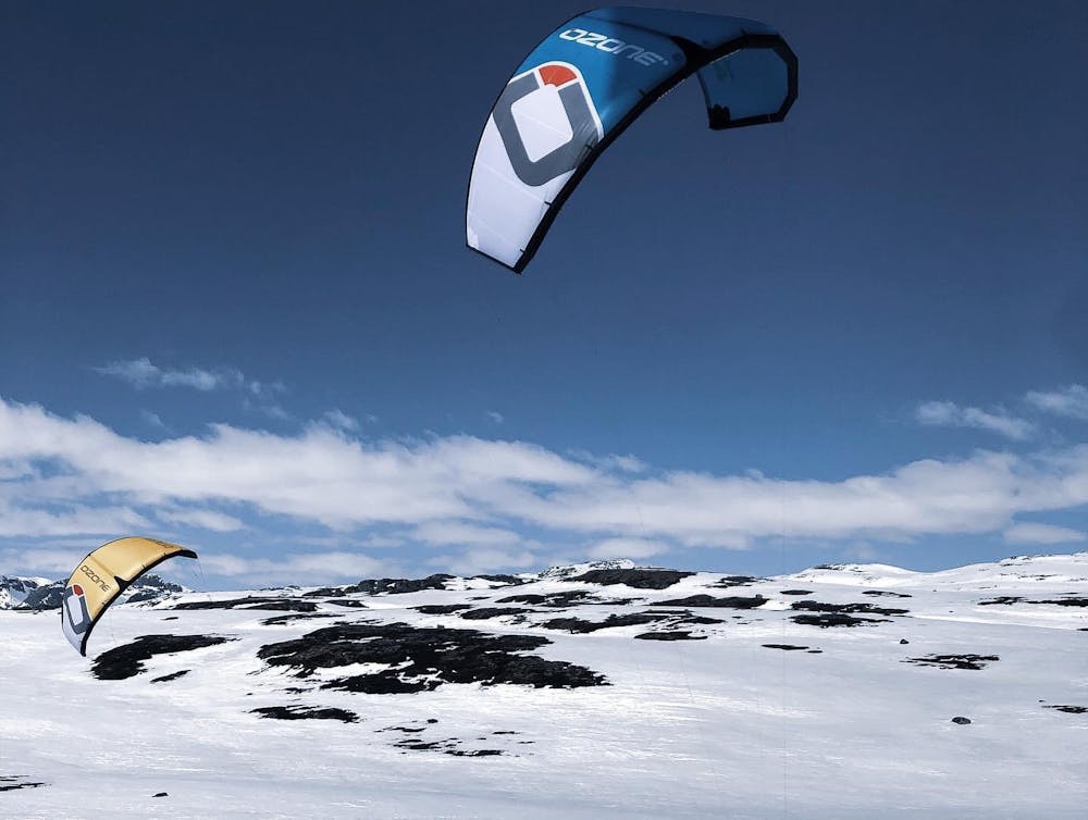 a man flying through the air on a snow board