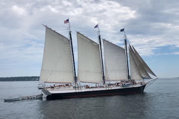 a 3 mast windjammer sail boat on the water for the Windjammer Parade Cruise