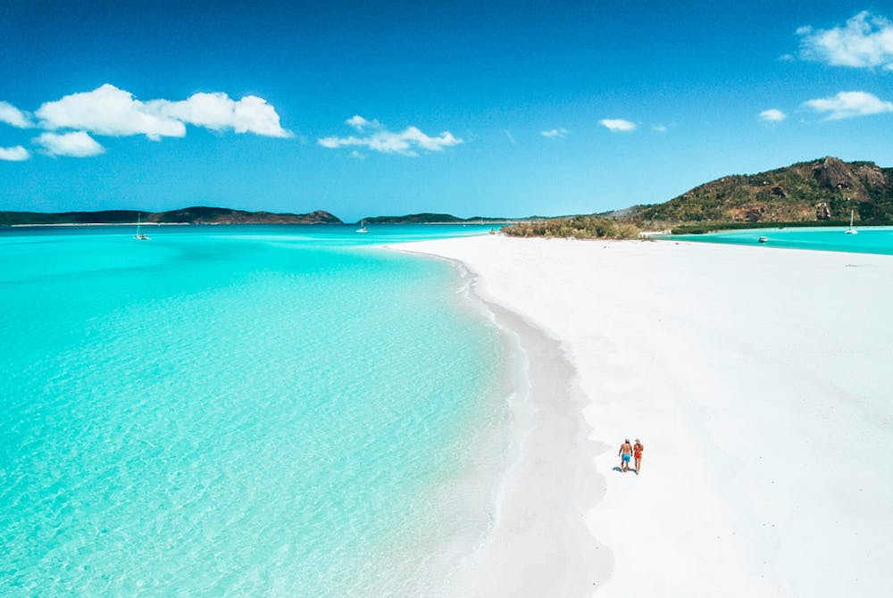 a body of water with Whitehaven Beach in the background