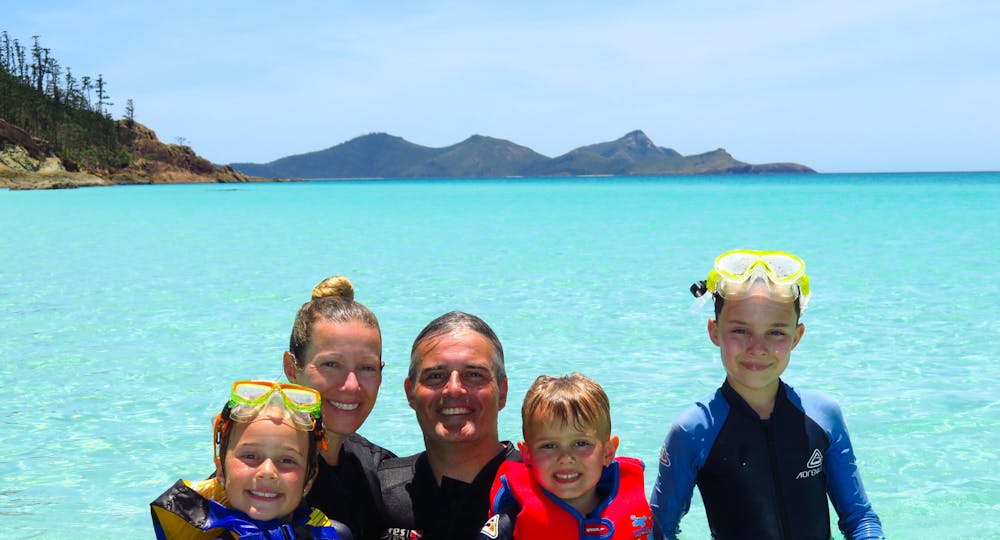 A Family enjoying the water at Whitehaven Beach