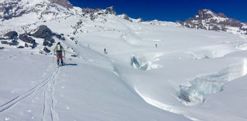 splitboarders cross glaciated terrain in the Cascades