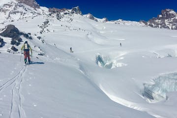 splitboarders cross glaciated terrain in the Cascades
