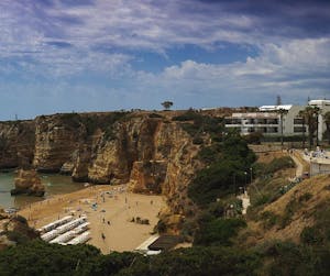 a view of a large rock best beaches in algarve portugal