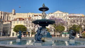 a statue in rossio square in Lisbon