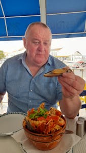 Phil eating seafood rice nazare portugal