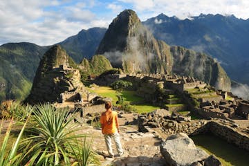 a person standing in front of Machu Picchu