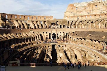 a large building with Colosseum in the background