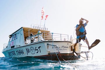 a man riding on the back of a boat