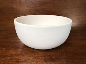 a close up of a bowl on a table