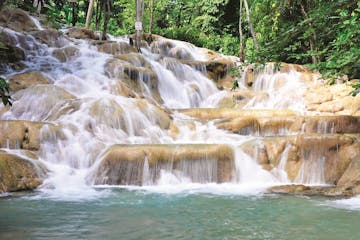 Dunn's River Falls into a body of water
