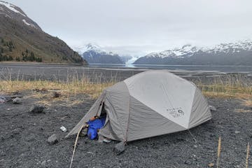 a tent with a mountain in the background