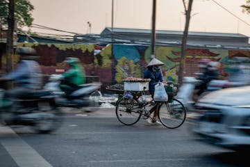 a person riding a bicycle on a city street