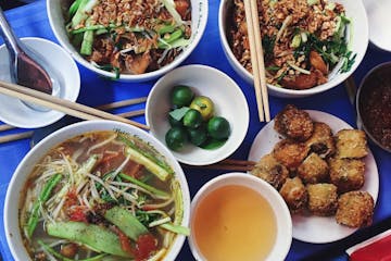 a bowl filled with different types of food on a table