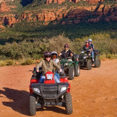 a group of people riding a ATVs in Arizona desert