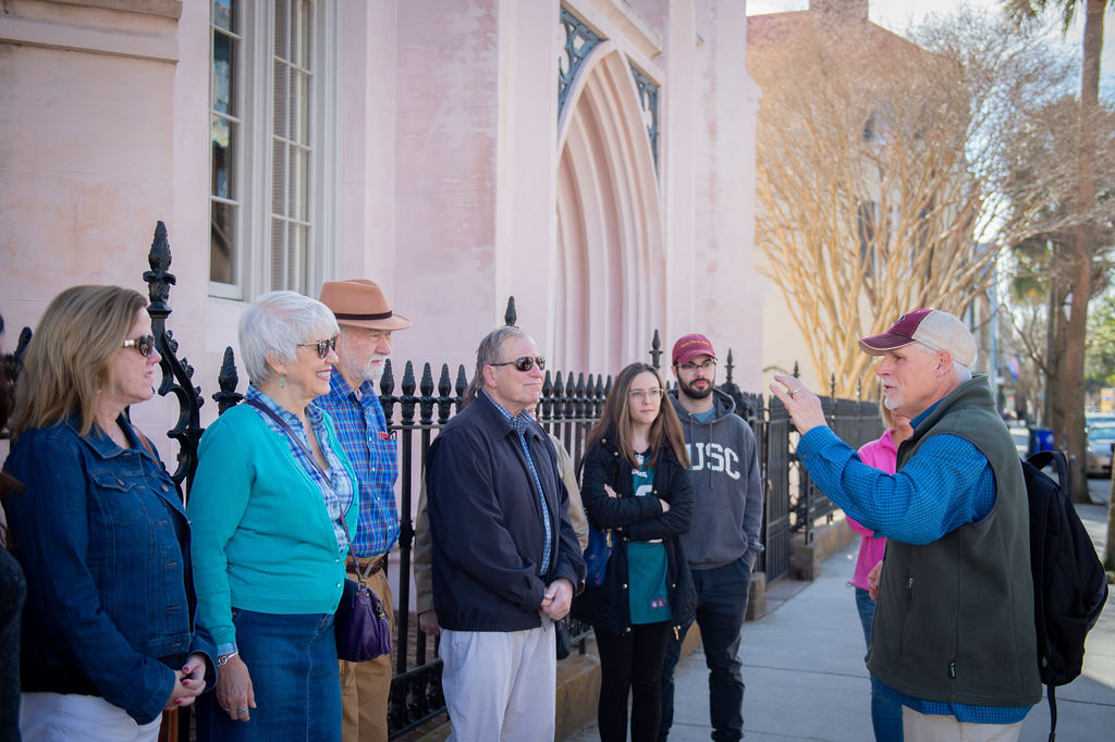 a group of people standing in front of a building