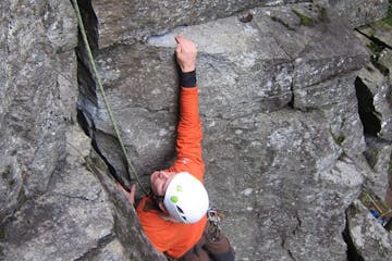 a man climbing on a rock wall