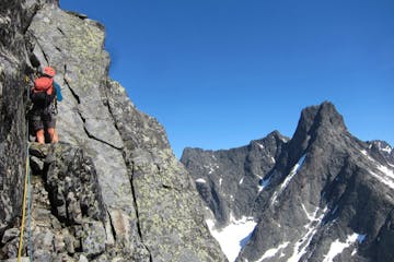a person standing in front of a rocky mountain
