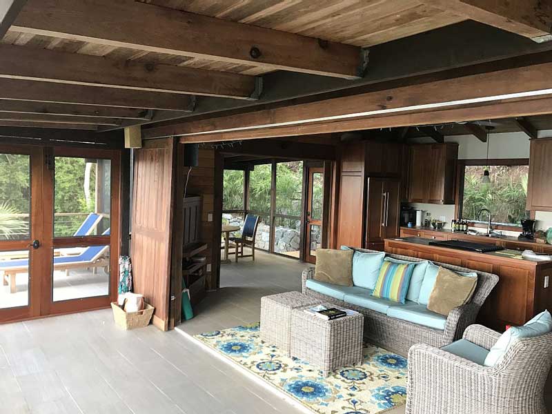 a living room filled with furniture and a large window