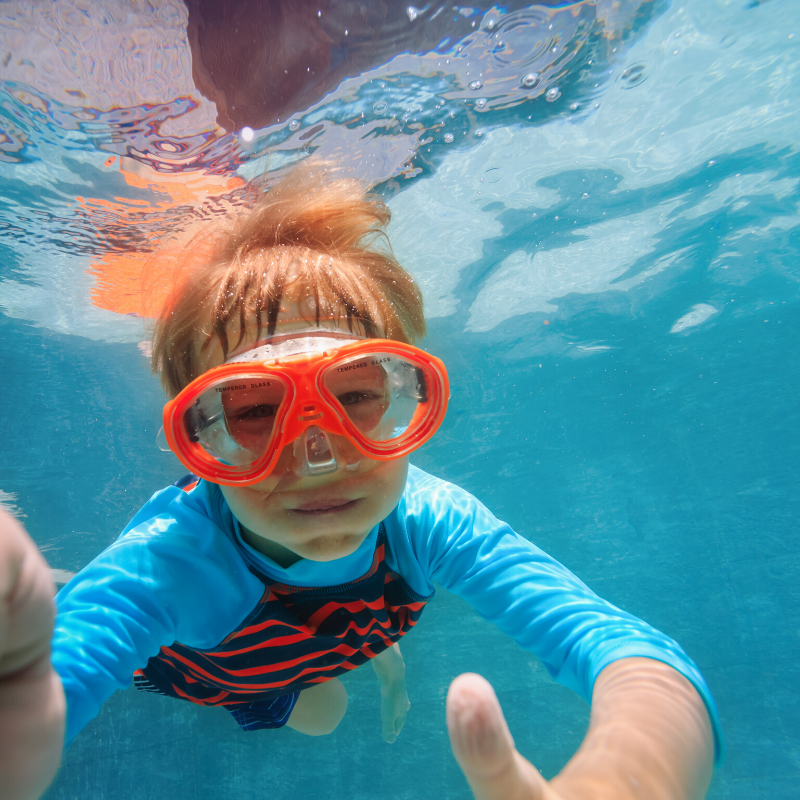 a person swimming in a pool of water