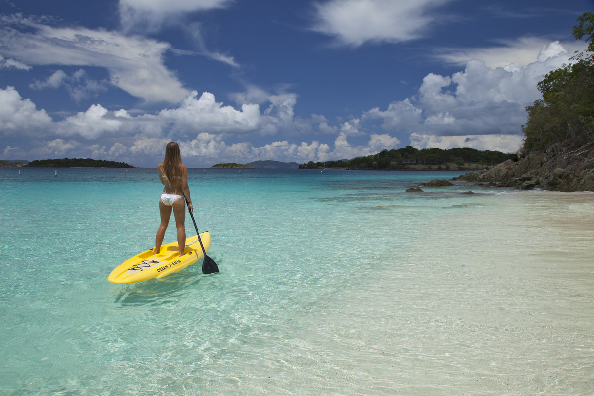 a person riding a surf board on a body of water