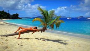 a sandy beach next to a body of water