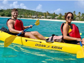 a group of people on a boat in the water