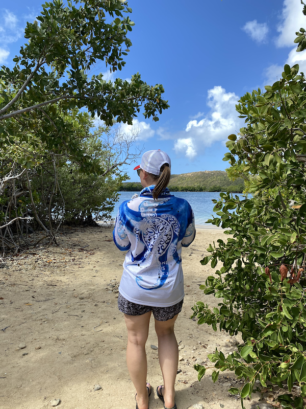 a person standing next to a tree