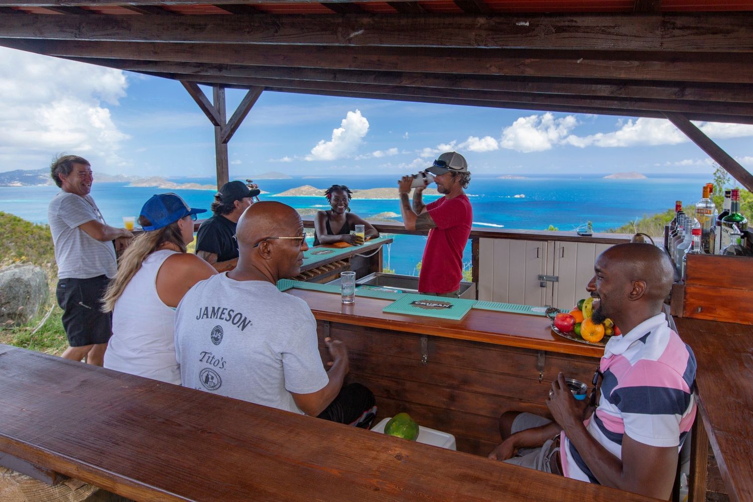 a group of people sitting at a picnic table