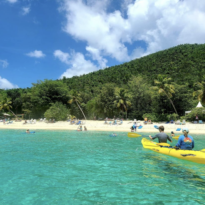 a group of people on a boat in a body of water