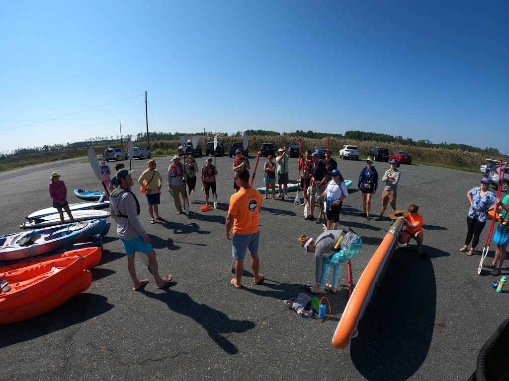 Capital SUP owner Kevin Haigis briefs paddlers before the adventure cruise