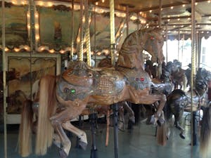 a group of people in a carousel