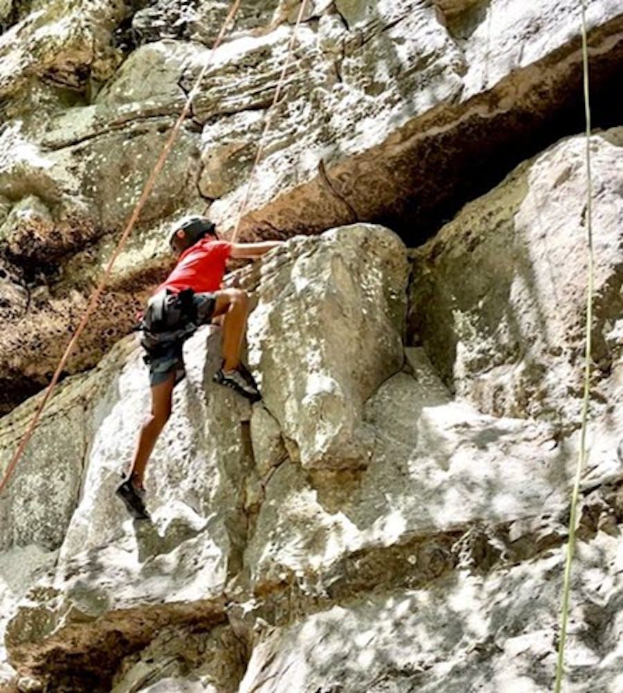 Kid Taking Rock Climbing Lesson